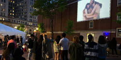A crowd watches as the film is projected in Market Square