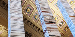 Three shaved down stacks of books tower over the viewer in the Fleet Library