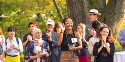 new presidential fellows are welcomed outside of Woods-Gerry House