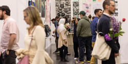 crowds view student work at Grad Show 2023