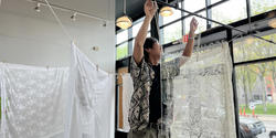 Corey Wantanabe string up clotheslines and hangs sheer lace fabric from them in the CIT building as a part of an installation for Snowtown monuments