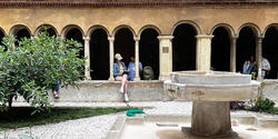 Students sit and sketch in Rome