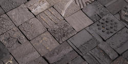 gray building tiles handmade using recycled soil