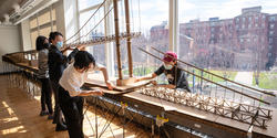 Interior Architecture students work on large model of the Pell Bridge