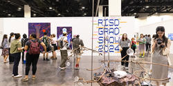 Visitors view work at Grad Show 2024