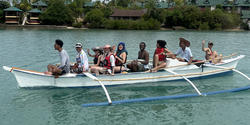students travel by bangka, a traditional Filipino outrigger canoe
