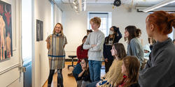 Mimi Cabell leads a class crit, as the group considers an oil painting