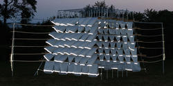 an architectural installation at Tillinghast glows in the twilit evening