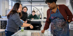 the class discusses work in progress during a midterm crit