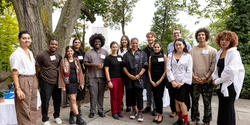 Presidential Fellows pose in front of Woods-Gerry House for a group photo