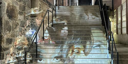 a collage of images projected on the stairs outside of the Chace Center