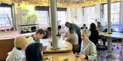 scientists gather in RISD's Nature Lab to discuss ideas for visualizing their research