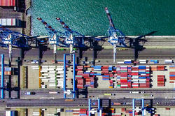 Aerial view of shipping containers and cranes