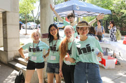 Students outside at new student orientation, in their orientation t-shirts