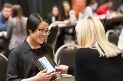 Student reviewing portfolio with a design professional at Design Portfolio Review