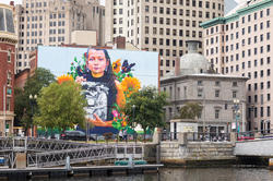 Still Here, a 100- x 120-foot mural celebrating Rhode Island’s indigenous people, by world-renowned street artist and muralist Gaia