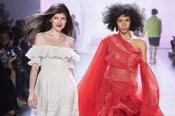 Designer Liz Shevelev (left) takes to the runway with one of her models