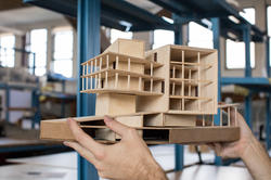 Architectural model being held up