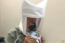 Gregory Jay conducts a fit test on a new mask prototype