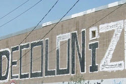 Graffiti that reads "Decolonize"
