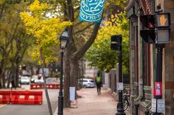 Benefit street with side of RISD buildings and RISD flag flying