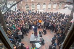 a crowd assembled around a speaker during an outdoor teach-in on RISD campus