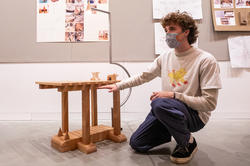 a Furniture Design student presents a table at crits