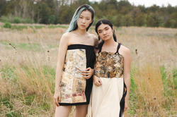 Two models standing in a field