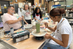 Project Open Door student painting in the Steel Yard