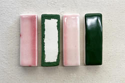 rectangular ceramic samples with pink and green glazes