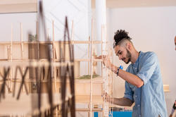 Student working on a project in wood