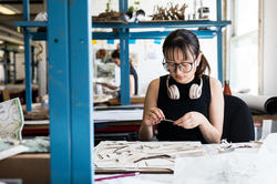 LDAR student with glasses building a model.
