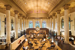 A downward-looking view of the Fleet Library’s golden-brown main hall