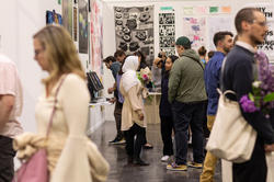 crowds view student work at Grad Show 2023