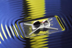 a robot on the surface of water, using vibration to stay afloat