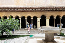 Students sit and sketch in Rome