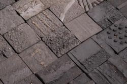 gray building tiles handmade using recycled soil