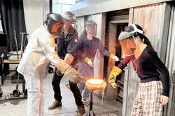students work together in the hot shop