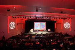 RISD Auditorium stage in intense red lighting