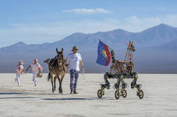 artists accompany a robotic horse across the Andes