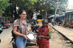 RISD student Upasana Pandey standing with a Bengaluru resident 