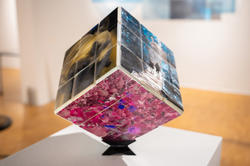 cube with photographs mounted on each side