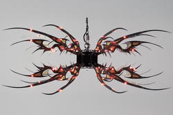 a wild-looking hanging fixture made with hand-drawn shapes in circuitboard