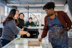 the class discusses work in progress during a midterm crit