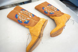 boots in progress with thread hanging down