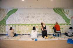 Students work on a mural