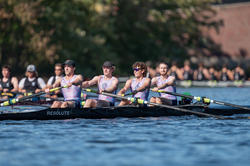 photo of four male rowers in risd uniforms