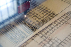 A laser cutter helps create an architectural model