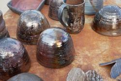 A table with several ceramic vessels