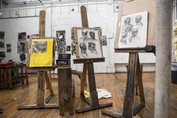 Sketchbooks on easels in studio